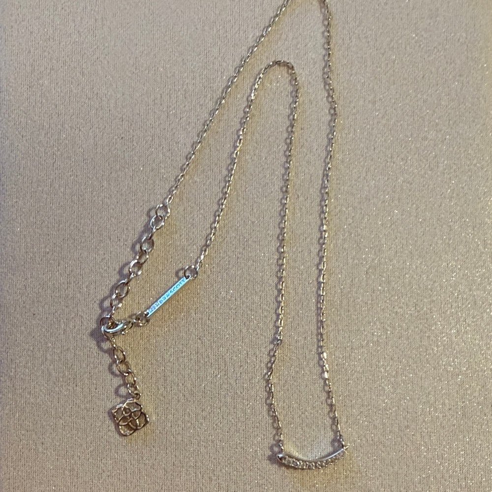Kendra Scott Silver Necklace with strand of cubic zirconia in feather like shape